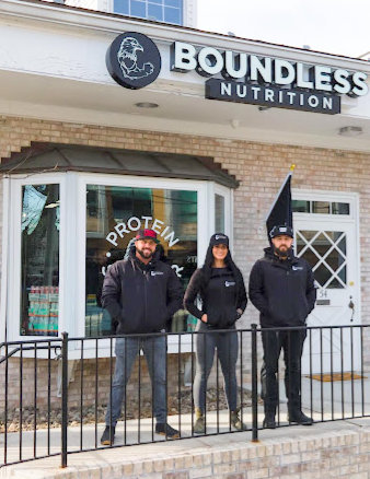 Boundless Nutrition exterior with 3 employees standing in front