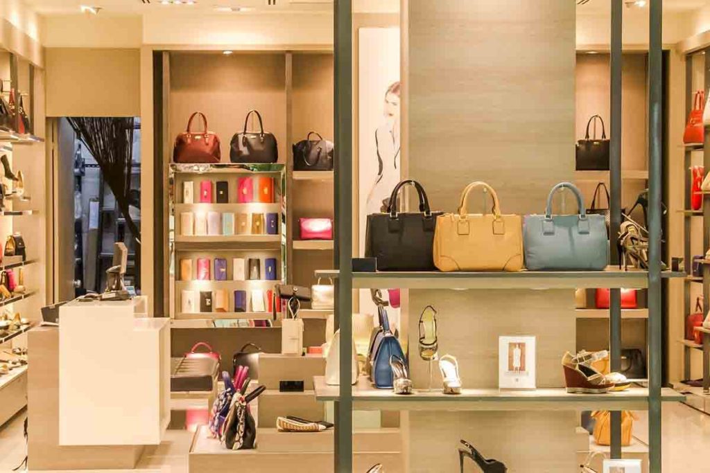 Local women's store displaying purses, shoes and other items